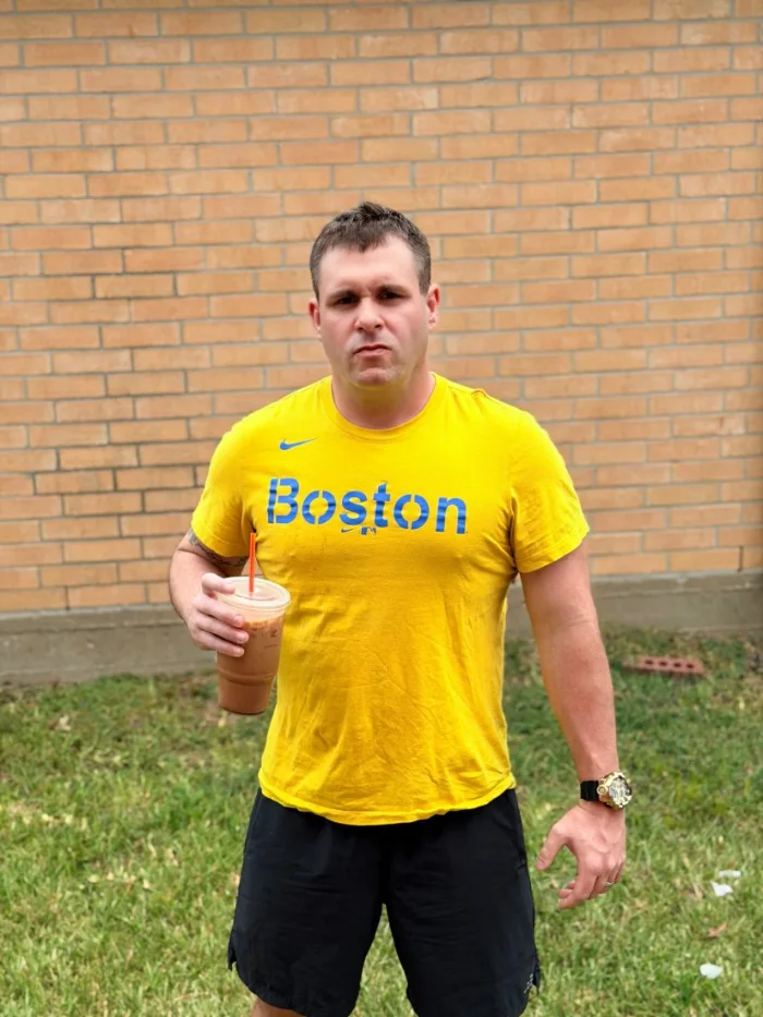 Sean, who built Turbo Search, holding an iced coffee and looking unimpressed